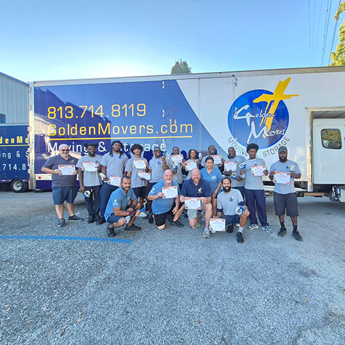 Plant City Moving Company Employees Holding Training Certificates