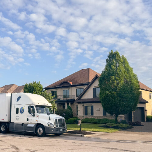 Commercial Moving Company For Interior Designers Tampa Florida Commercial Moving Company Truck In Front of a Luxury Home in Tampa FL