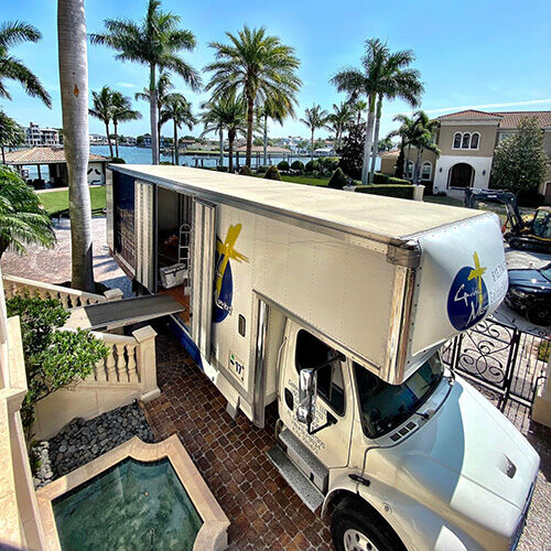 Truck of Moving Company Parked In Front of a Largo FL Resort To Load Furniture