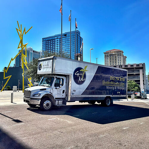 Moving Company Sarasota Florida Truck of Moving Company Passing By a Commercial Area in Sarasota FL