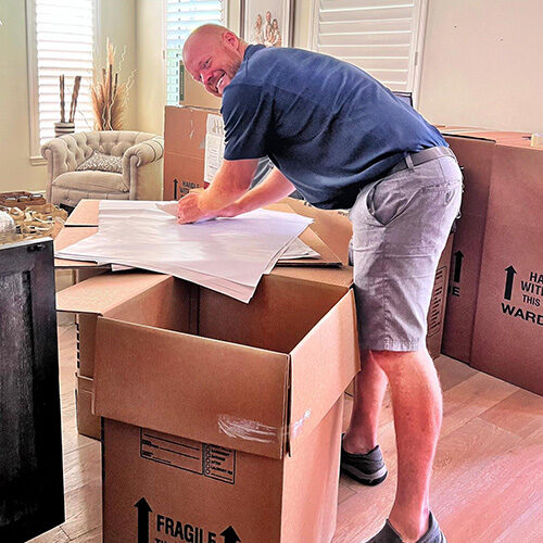 Moving Company Tallahassee Owner of Top Moving Company in Tallahassee Florida Helping with Boxing Small Items