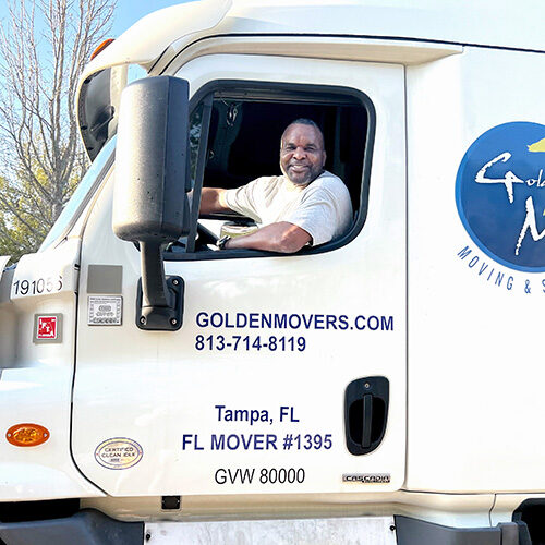 Moving Company in Jacksonville FL Driver of Moving Company Ready for Long Distance Move To Jacksonville Florida
