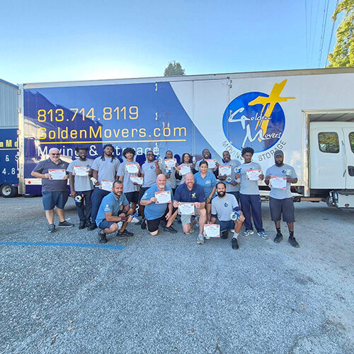 Employees of a Moving Company in Odessa Florida Holding Training Certificates