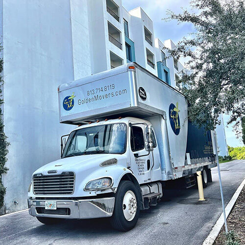 Office Movers in Tampa Florida Truck of Office Movers Leaving Building in Tampa FL To Transport Company Relocating Interstate