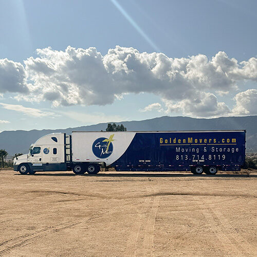 Residential Long Distance Moving Company in Tampa Florida Residential Long Distance Moving Company Truck On The Way to Tampa FL Seen With Mountain in the Background
