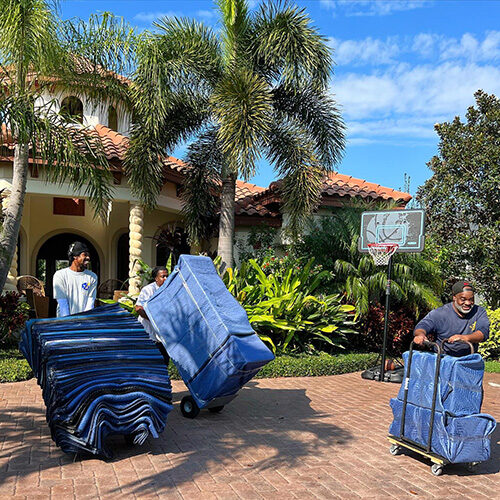 Residential Luxury Moving Company Tampa FL Moving Company Employees Carrying Items To Truck Going to Luxury Residential Property in Tampa Florida
