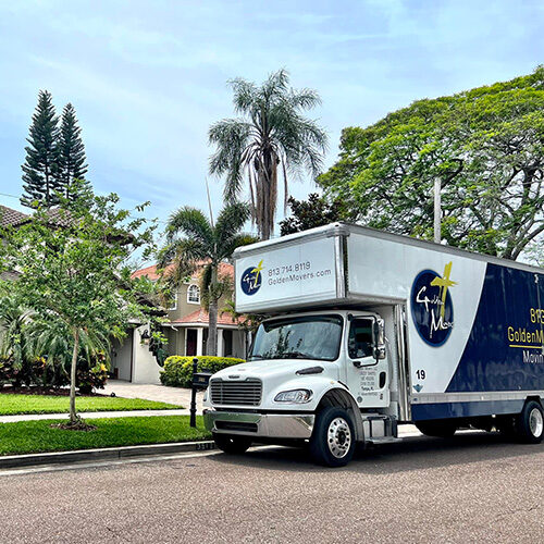 Residential Moving Company Tampa Bay FL Truck of Moving Company Leaving Residential Subdivision To Relocate a Tampa Family